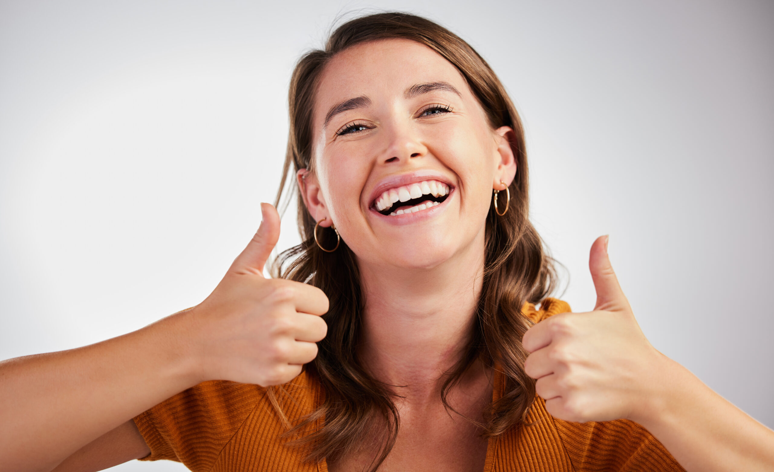 Adult patient smiling confidently after a comfortable dental visit